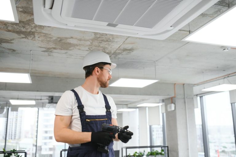 HVAC technician providing 24/7 AC repair in Katy, TX, fixing a unit for round-the-clock cooling support.
