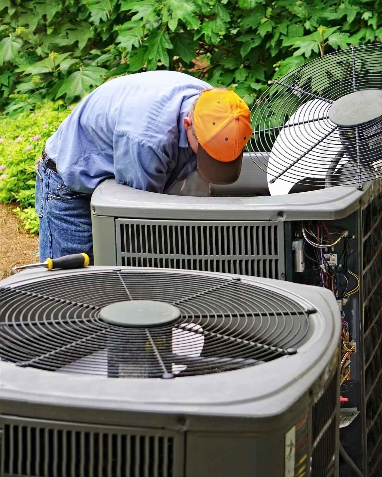 Technician repairing outdoor AC unit emergency ac repair Grand Lakes Phase Two