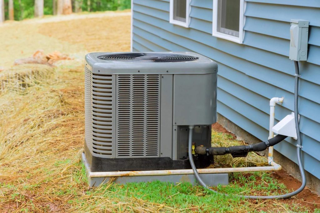 Modern AC unit outside a home, highlighting 24/7 AC repair services in Katy, TX.