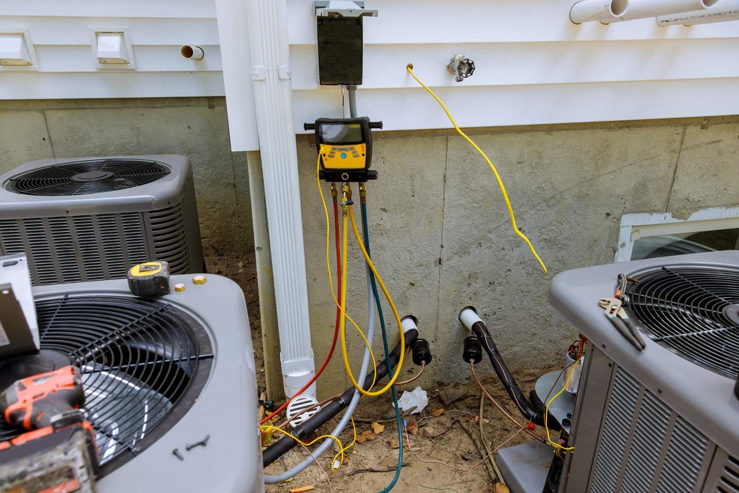 Technician securing an AC unit on a rooftop with tools, offering AC installation in Katy, TX.