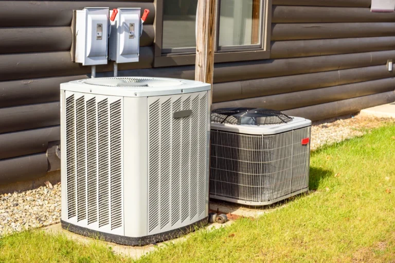 Outdoor AC units with power shutoff boxes ready for free service call ac repair katy tx residential HVAC inspection.