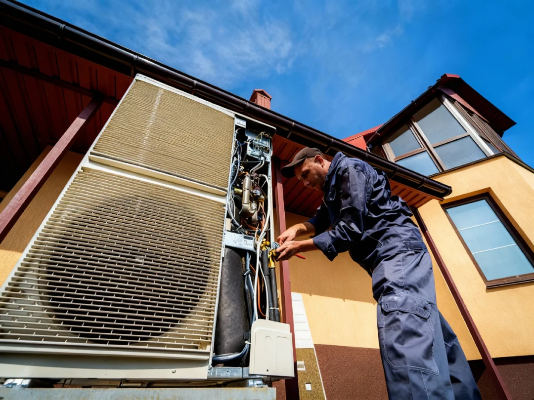 Expert installing wiring in outdoor AC unit for reliable AC installation Katy TX.