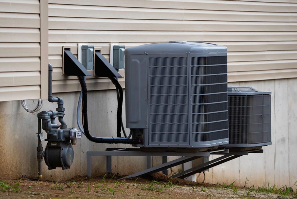 Modern outdoor air conditioning units installed beside home, serviced by the best AC repair company in Katy TX for reliable cooling performance.