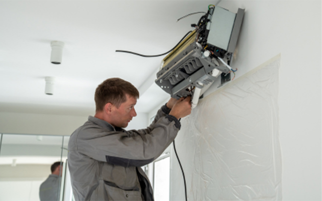 Our pro team finalizing a high-efficiency ac installation fulshear tx for a modern ductless wall-mounted system.
