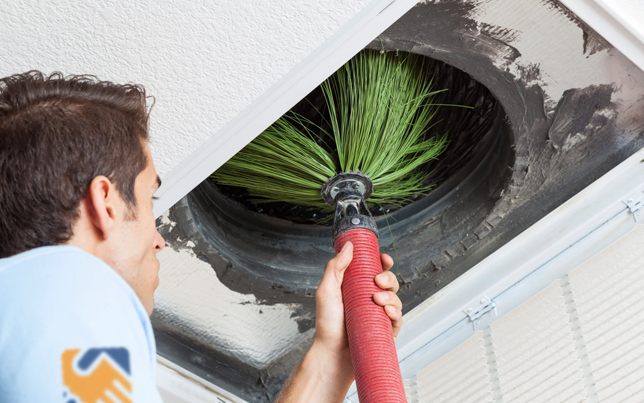 Professional expert performing an ac maintenance fulshear tx by adjusting a residential rooftop condenser unit.