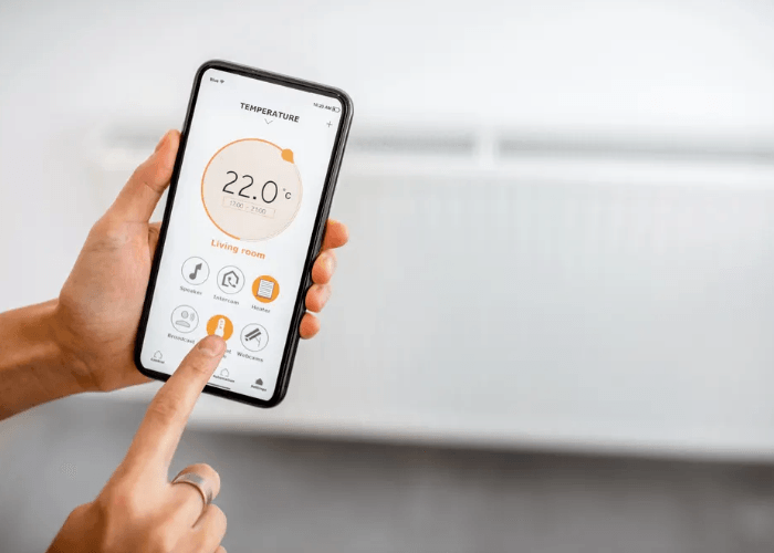 Using a smart home app to adjust heating on a phone, a great reason to upgrade to smart thermostats Katy Tx today.