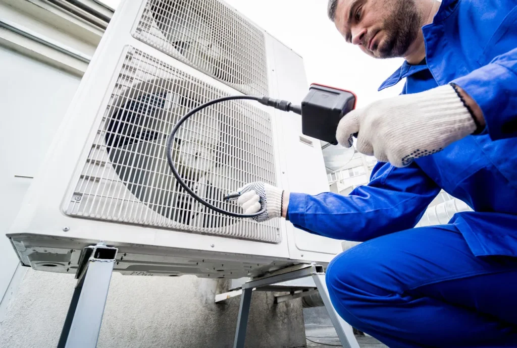 Expert leak detection using electronic tools during a professional free quote AC repair Katy TX residential inspection.