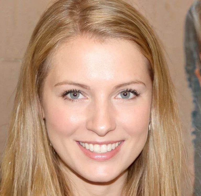 Headshot of a happy blonde woman sharing her feedback after receiving top-notch Goodman AC repair Katy TX service.